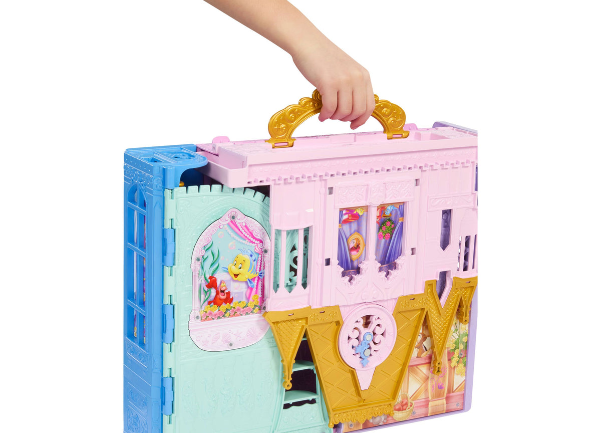 Disney Princess Rapunzel Close & Carry Castle playset in pink, blue, and gold with handle, featuring multiple play ar...
