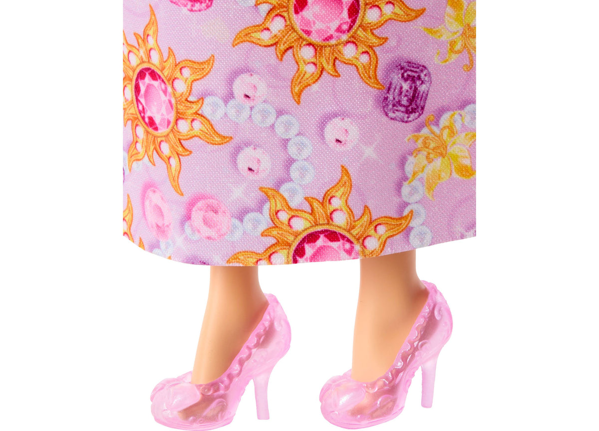 Disney Princess Rapunzel fashion doll wearing pink jeweled gown and matching pink heeled shoes