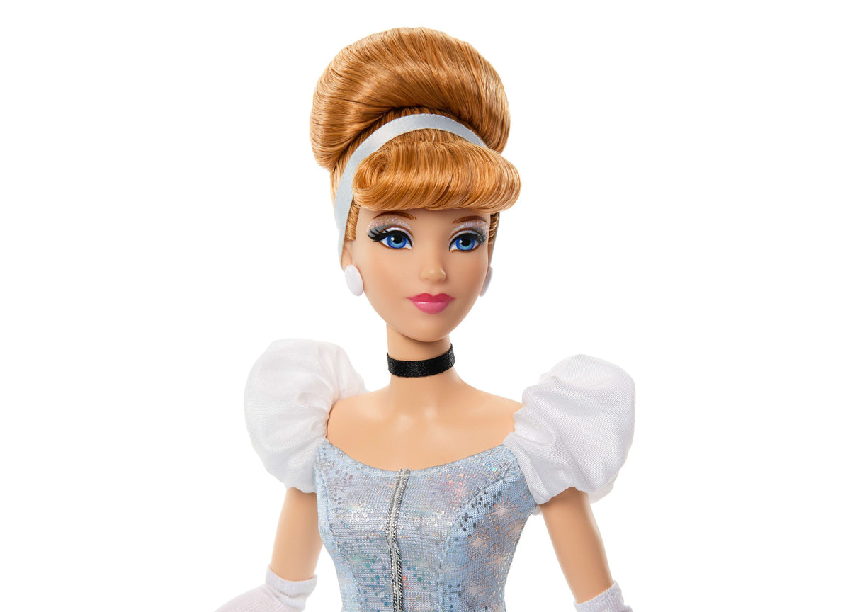 Disney Princess Sparkling Princess Cinderella doll wearing blue sequined gown with white puffed sleeves and black cho...