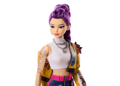 Kpop Demon Hunters Rumi 11" doll with purple hair, white crop top, gold jacket, and tattoo details