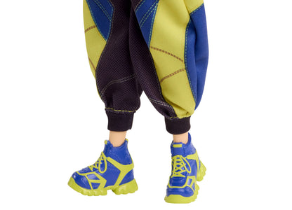 Kpop Demon Hunters HUNTR/X Zoey doll wearing blue and yellow outfit with matching sneakers