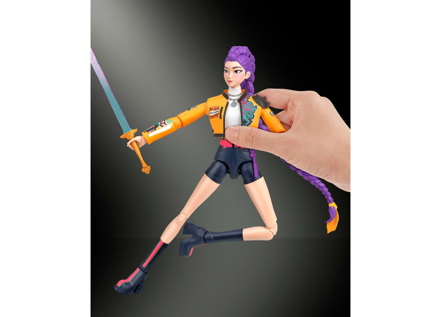 Kpop Demon Hunters Rumi 6-inch action figure with purple hair, yellow jacket, articulated joints, and interchangeable...