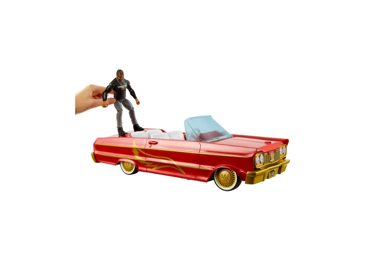 WWE Rey Mysterio Main Event Lucha Low Rider red and gold convertible vehicle with blue windshield, shown with articul...