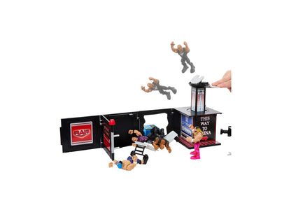 WWE The Rock Knuckle Crunchers Final Boss microphone playset with black and red arena backdrop, launching action figu...
