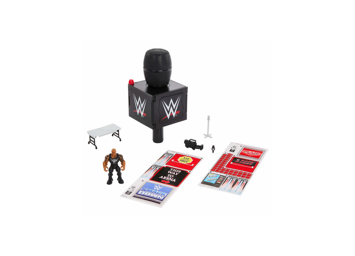 WWE The Rock Knuckle Crunchers microphone playset with black microphone tower, action figure, bench, and accessories ...