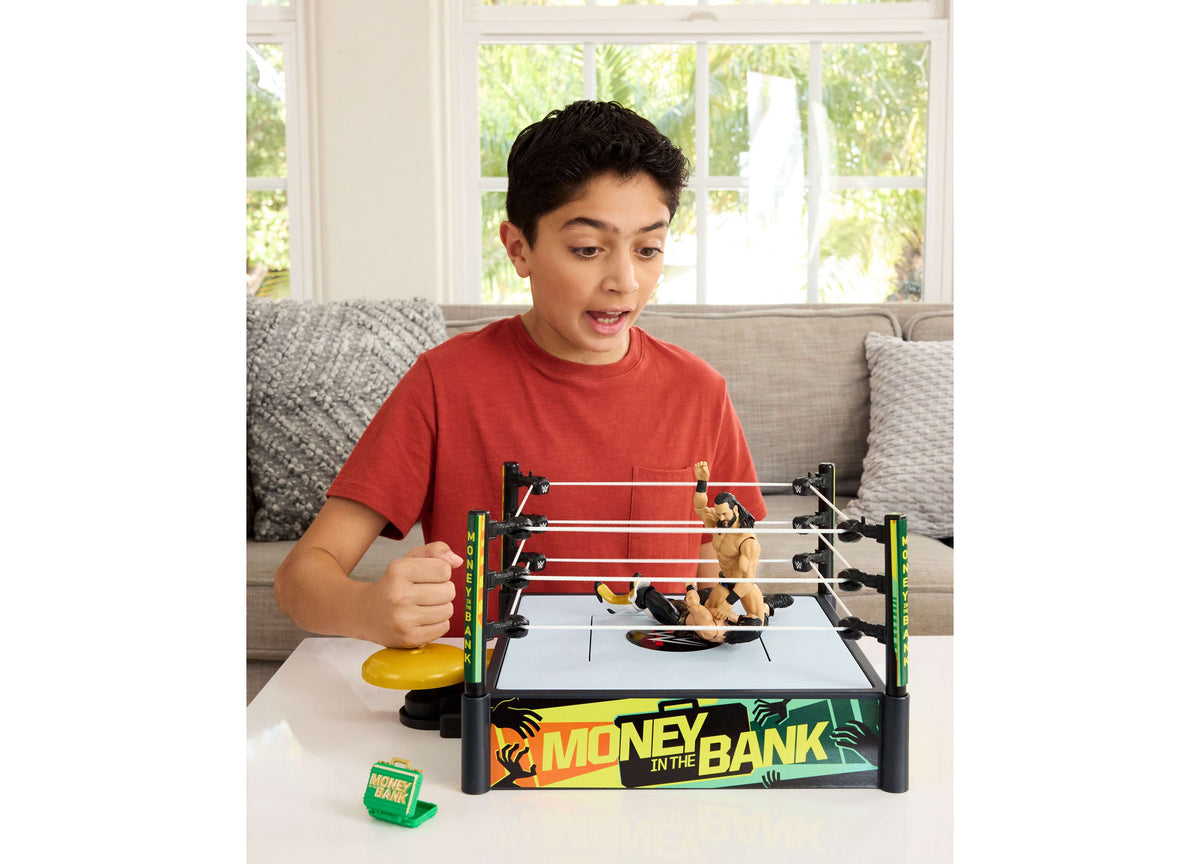 WWE Money In The Bank Ring Playset with red ropes, yellow briefcase, and action figures