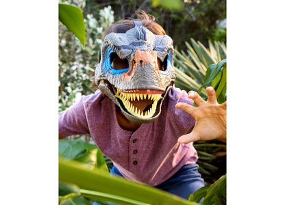Jurassic World Velociraptor mask with moving jaw, fierce teeth, blue eye markings, worn by child in purple shirt