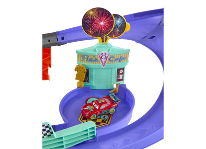 Cars Lightning McQueen Light-Up Celebration Raceway playset with purple track, turquoise ice cream cafe, and firework...