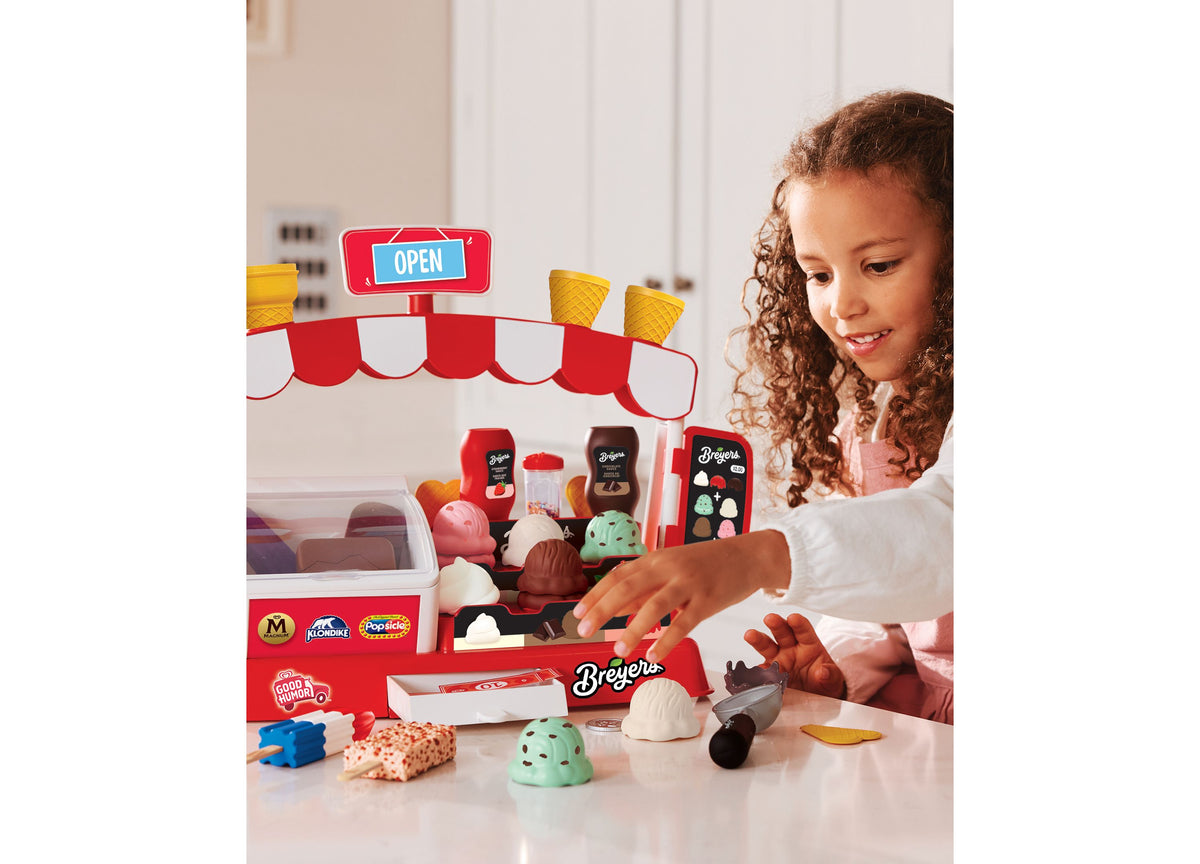 Casdon Ice Cream Parlor playset with red and white striped awning, featuring ice cream scoops, freezer, and 35+ piece...