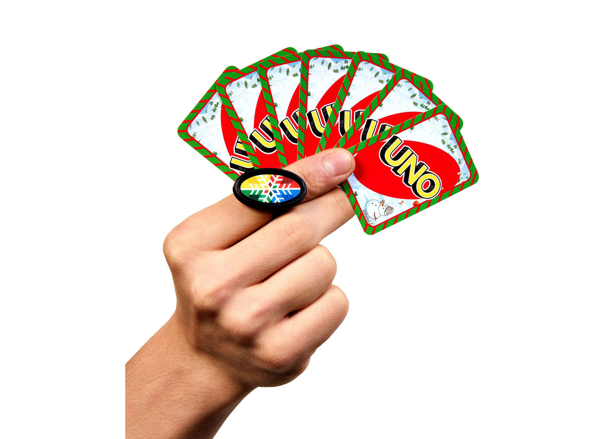 UNO Advent Calendar with red and green festive design, hand holding game piece, cards fanned behind