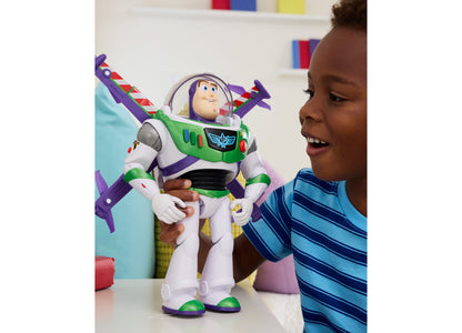 Toy Story Buzz Lightyear action figure with purple wings held by child in blue striped shirt
