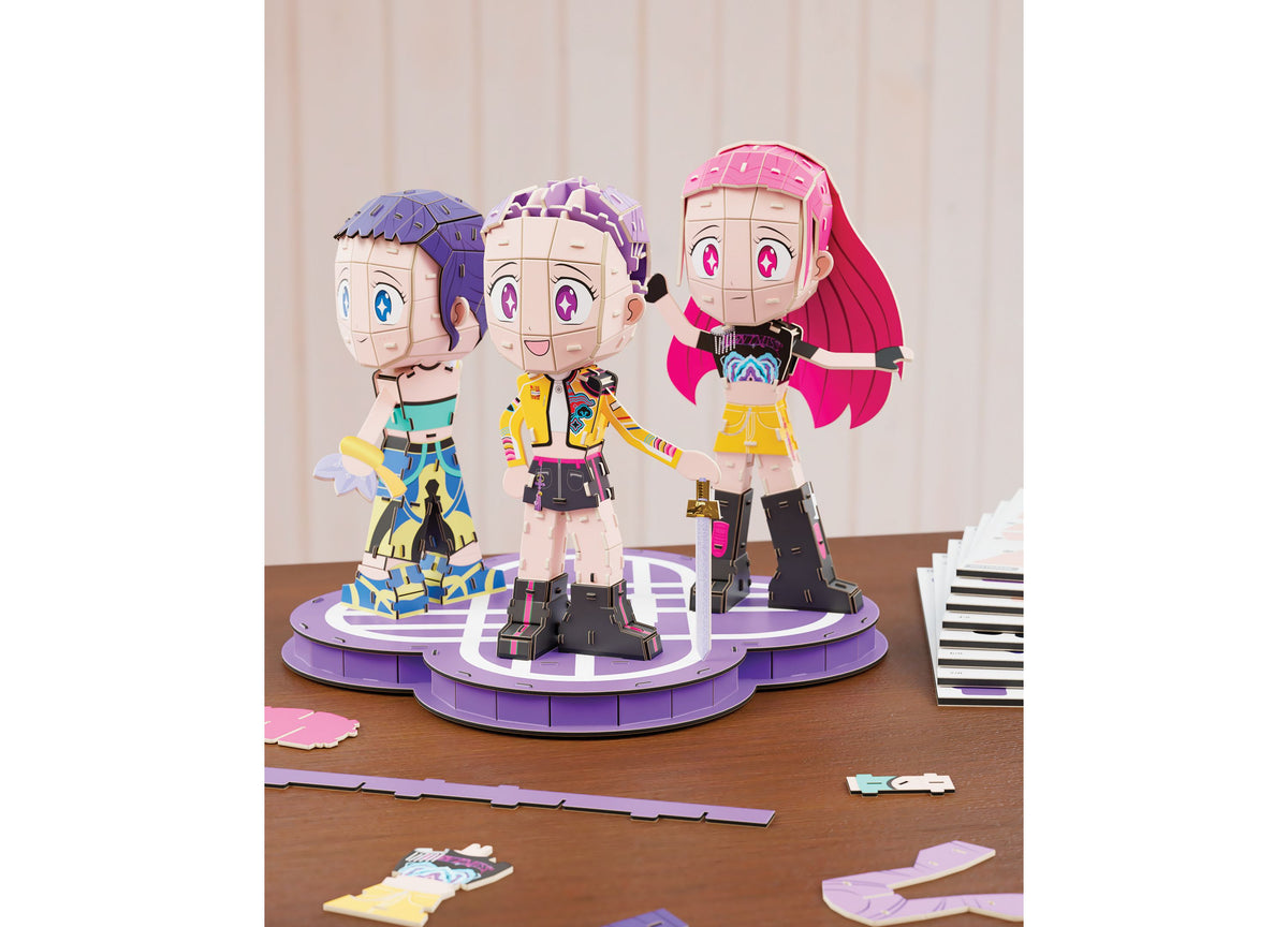 Spin Master 4D Build KPOP Huntrix Chibi Set featuring three colorful chibi character figures with purple bases and pi...