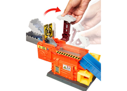Matchbox Launch & Crush Playset with orange base, blue ramp, and white car being placed on track