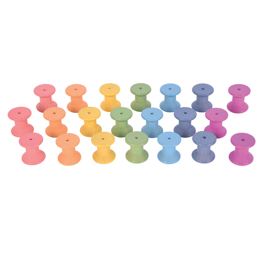Set of 21 wooden spools in rainbow colors: pink, orange, yellow, green, blue, purple, and magenta, arranged in rows on a plain background