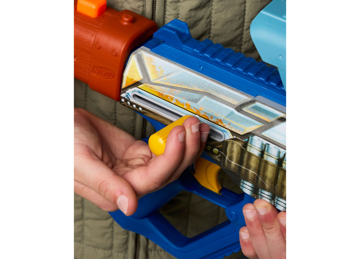 Child holding blue Nerf Star Wars Mandalorian blaster with yellow dart and red blaster visible