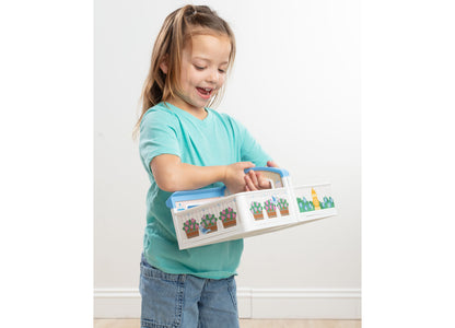 Melissa & Doug Cheery Lane Fold-Out Rooms House with girl opening doors on cactus-themed rooms