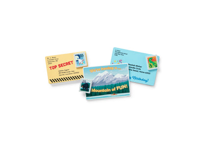 Melissa & Doug Stamp & Sort Mailbox Playset with colorful mail cards and envelopes arranged around a blue mailbox wit...