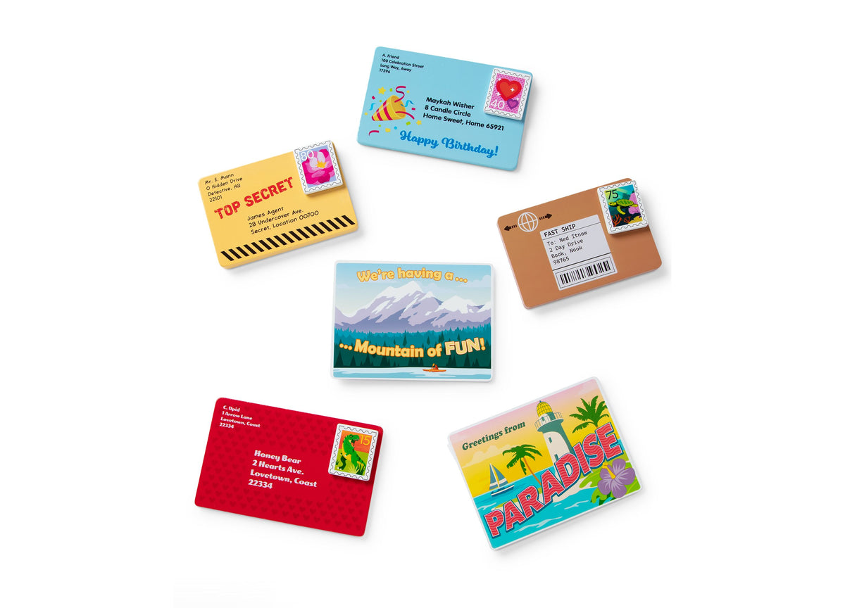 Melissa & Doug Stamp & Sort Mailbox Playset with colorful mail envelopes and accessories arranged around a sturdy mai...
