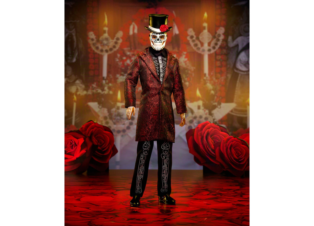 Barbie Día De Muertos Ken doll in crimson jacket with skeleton embroidery, mask, and top hat against red roses and or...