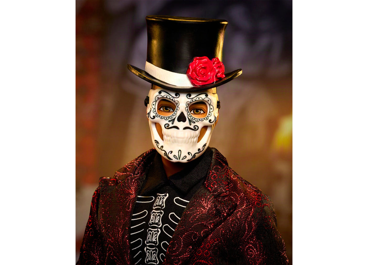 Barbie Día De Muertos Ken doll wearing skull mask, black top hat with red rose, and red glittery jacket with skeleton...
