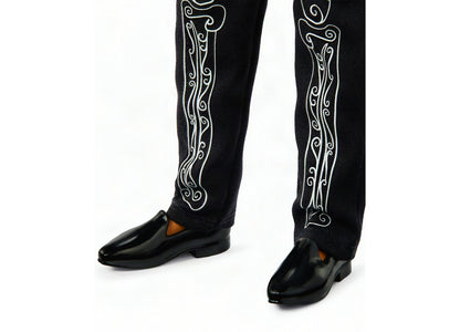 Barbie 2026 Día De Muertos Ken doll wearing black jacket with white skeleton embroidery and black shoes
