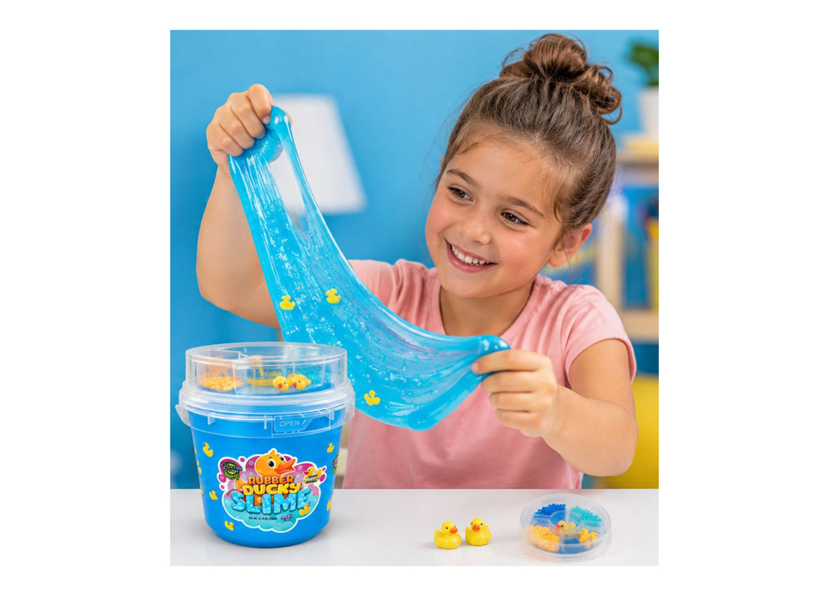 Child in pink shirt stretching blue Rubber Ducky Slime with yellow duck charms visible in bucket
