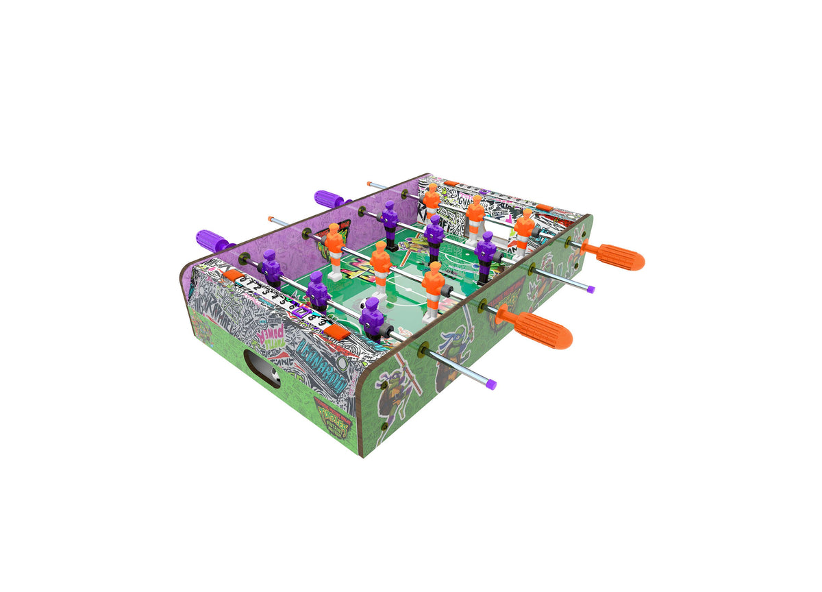 TMNT Mutant Mayhem 2-Player Foosball Table with purple and orange player figures, green playing surface, and orange h...