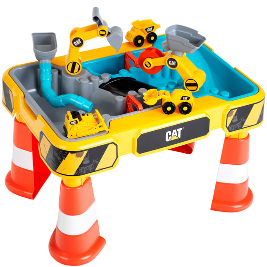 CAT-branded sand and water play table with yellow and blue base, red and white legs, includes mini construction vehicles and interactive accessories