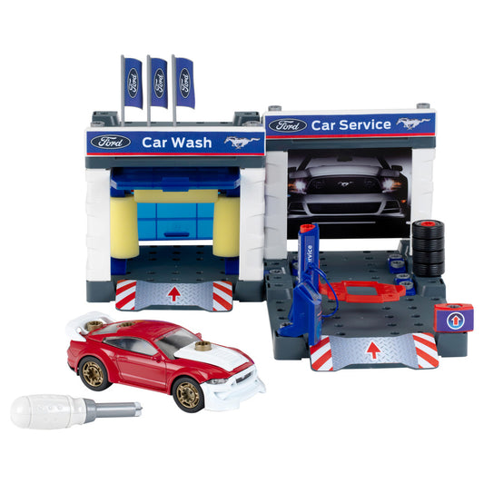 Ford Car Wash and Service Station playset with red and white diecast Mustang car, blue hydraulic lift, yellow car wash tunnel, flags, tire stack, and accessorie
