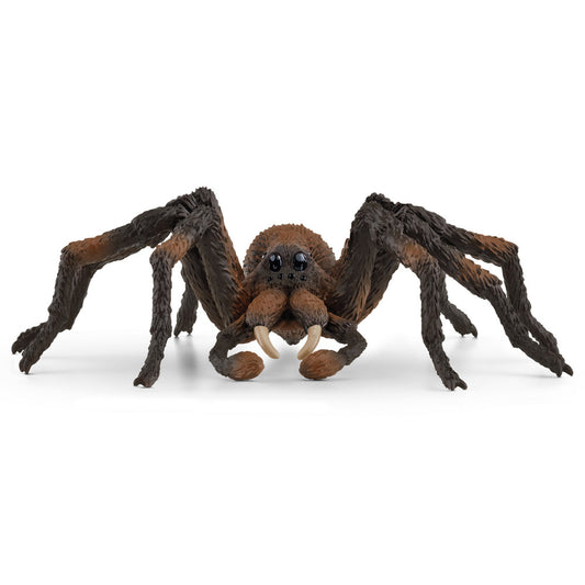 Brown and black spider action figure with fuzzy body, large eyes, ivory fangs, and eight articulated legs on plain background
