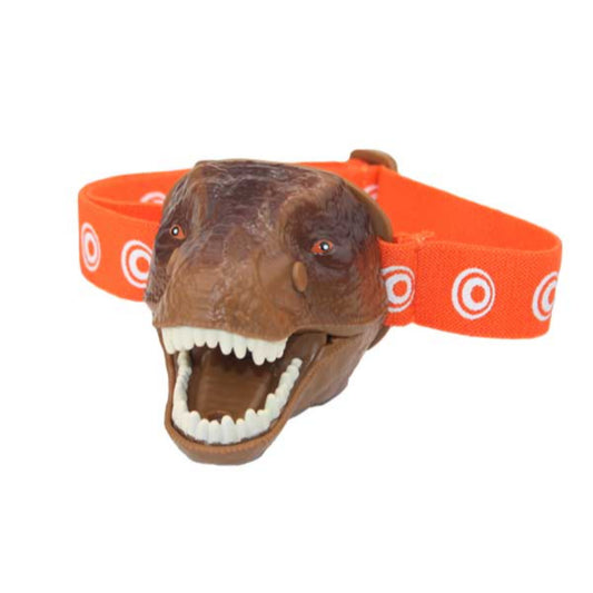Brown T-Rex dinosaur head headlamp with open mouth and white teeth, attached to orange elastic band with white circle pattern