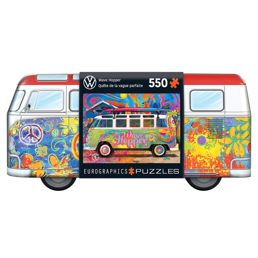 Eurographics VW Wave Hopper 550-piece puzzle in collectible bus-shaped tin featuring colorful psychedelic VW van artwork on red and white retro bus packaging