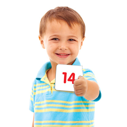 Match It Numbers toy with child holding card showing number 14