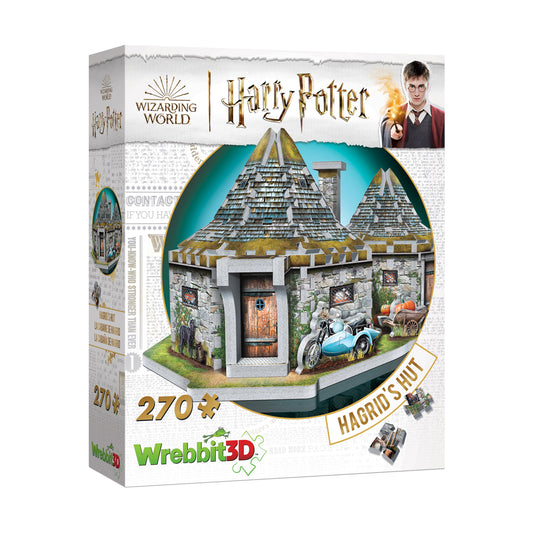 Wrebbit 3D puzzle box featuring Hagrid's Hut from Harry Potter, showing assembled stone cottage with peaked roofs, wooden door, and blue motorcycle with sidecar