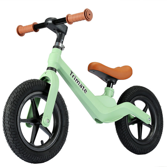 Mint green balance bike with black wheels, brown handlebar grips, and brown saddle seat, shown on plain white background