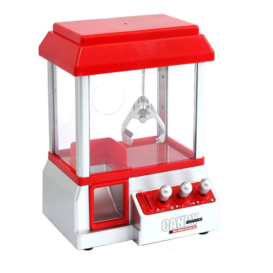 Red and white mini claw machine arcade toy with transparent sides, red canopy top, and control buttons on base