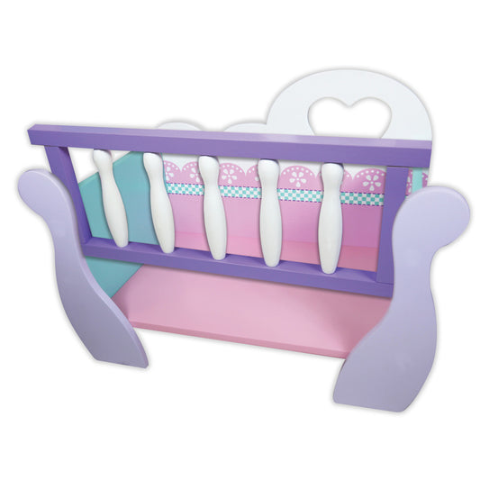 Purple wooden doll cradle with pink mattress, white bedding with floral and checkered patterns, and white hanging toys