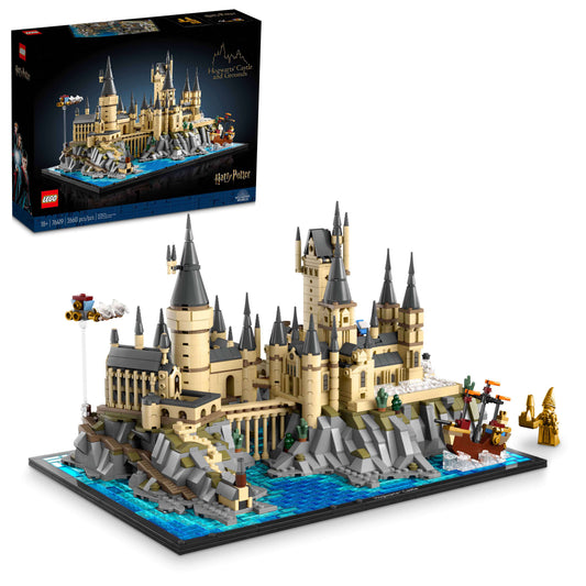 LEGO Harry Potter Hogwarts Castle and Grounds building set showing tan and gray castle with multiple towers on rocky base surrounded by blue water, displayed wi