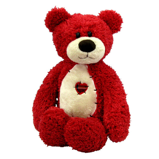 Red plush teddy bear with cream-colored chest and heart design, black nose and eyes, sitting pose on plain white background