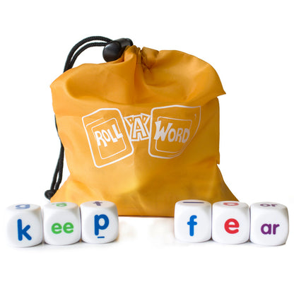 Roll A Word spelling dice game with yellow carry sack and six white letter dice cubes