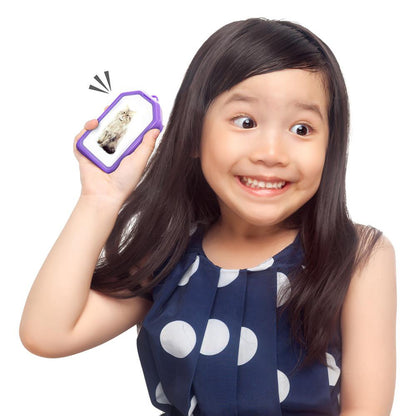 Girl holding purple Rainbow Recorder toy displaying playback screen with owl image