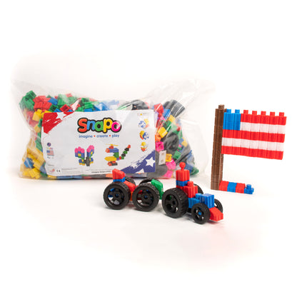 Snapo Mega Builders Kit 1100-piece construction set with colorful blocks, wheeled vehicles, and building structures