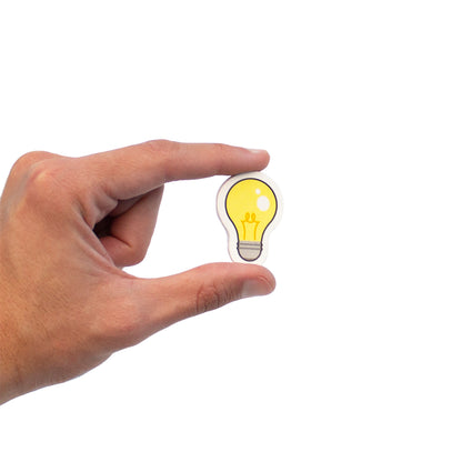 Junior Learning Vowel Objects Educational Set - yellow lightbulb magnetic foam toy in hand