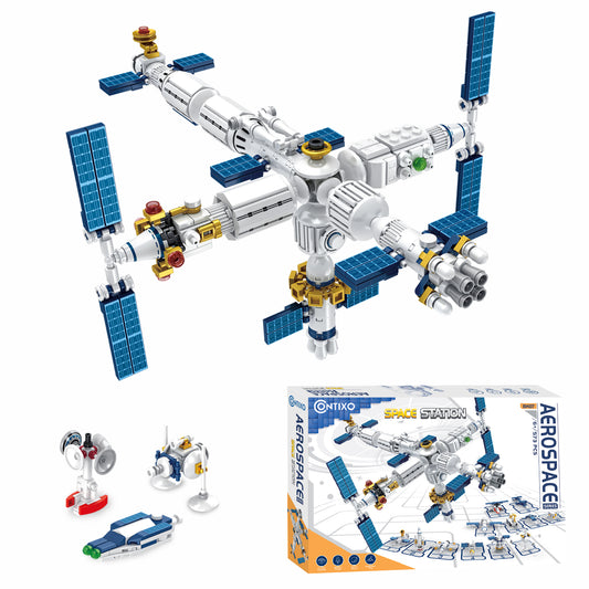 Contixo Space Station building block set with white and blue modular spacecraft components, solar panels, gold accents, and small accessory pieces displayed wit