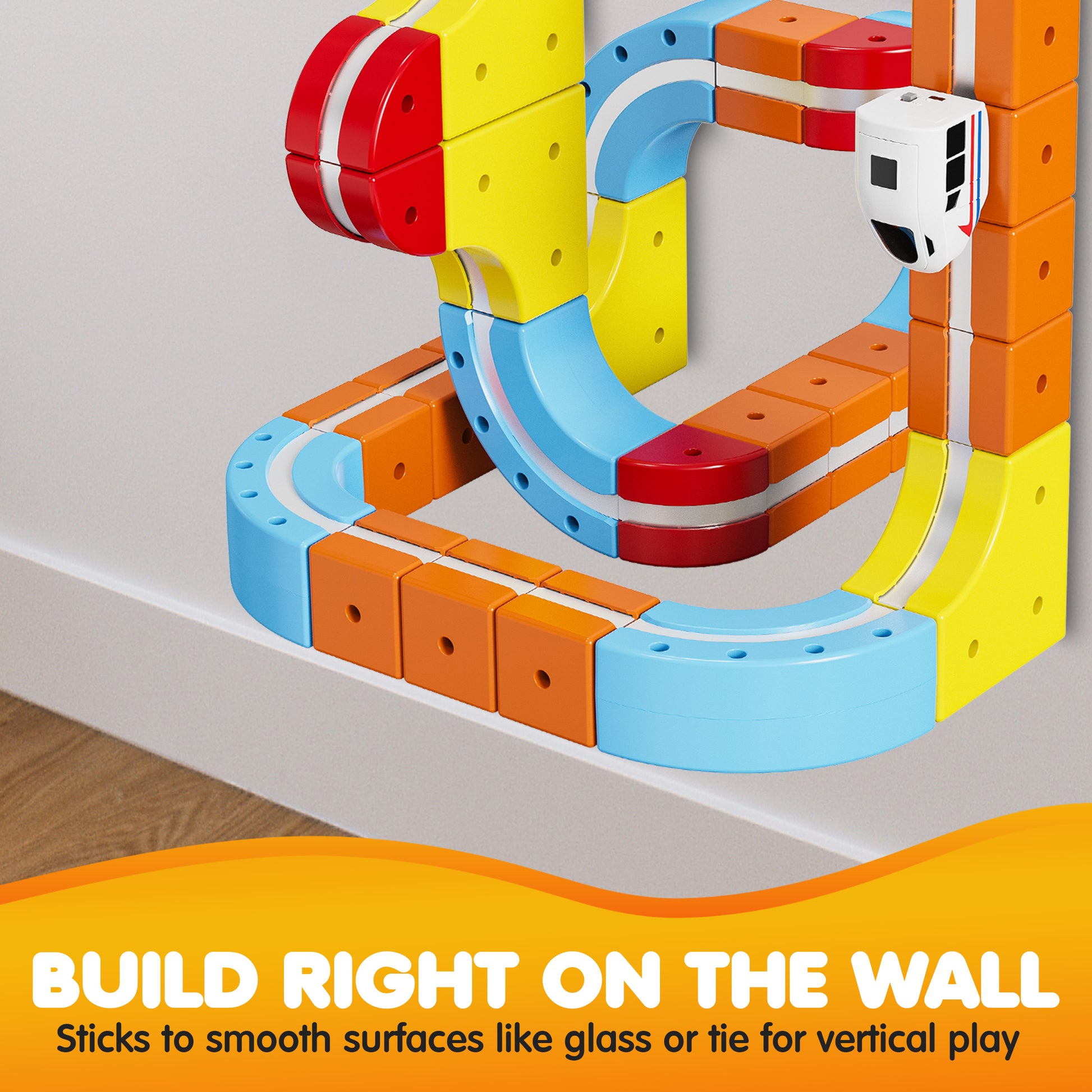 Contixo Magnetic Train Track Set with colorful building blocks in yellow, orange, blue and red, demonstrating wall-mo...