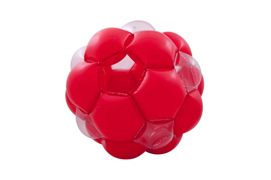 Red and translucent inflatable ball with transparent bubble-like segments on white background