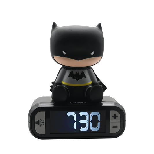 Black Batman figure sitting on top of a digital alarm clock displaying 3:30, with a bat symbol on the chest and yellow utility belt detail