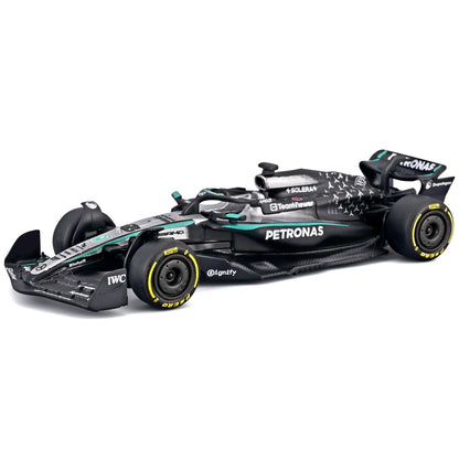 Bburago 1:43 Mercedes W16 Formula race car with pit pass playset, black with turquoise and white accents