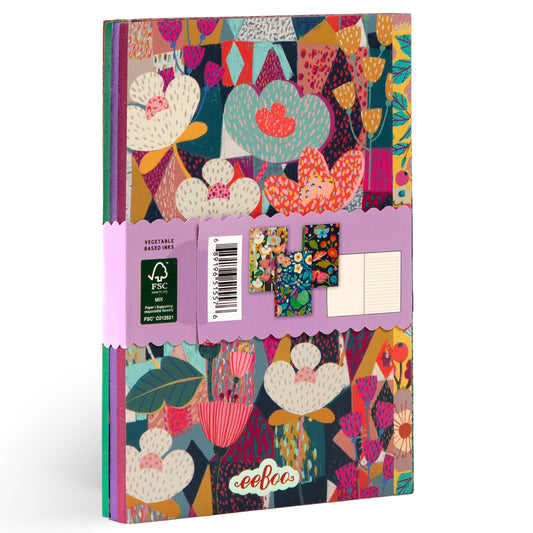 Three small notebooks with colorful cacti and floral patterns on covers, banded together with a pink belly band showing FSC certification and product details