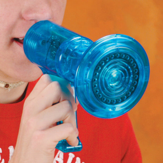 Child modeled by a child holding blue megaphone voice changer toy to mouth against orange background